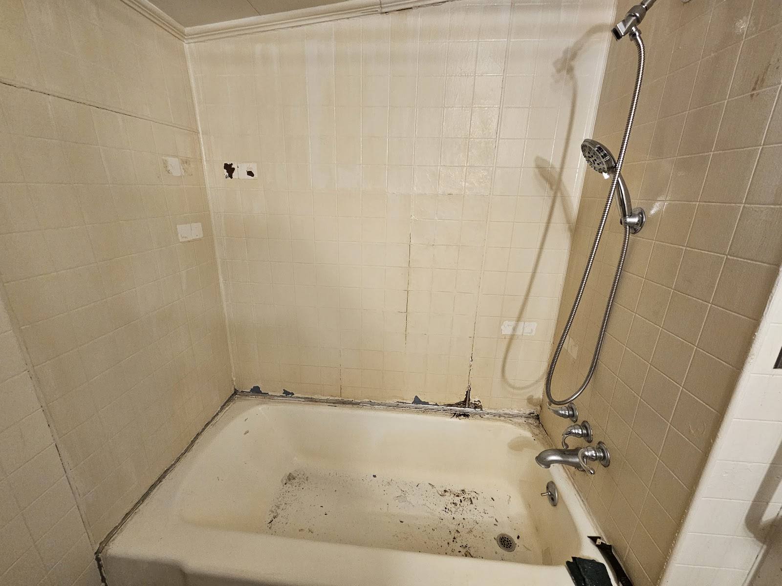 Worn bathtub before refinishing