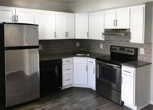 Completed compact kitchen featuring Qwikkit cabinet products