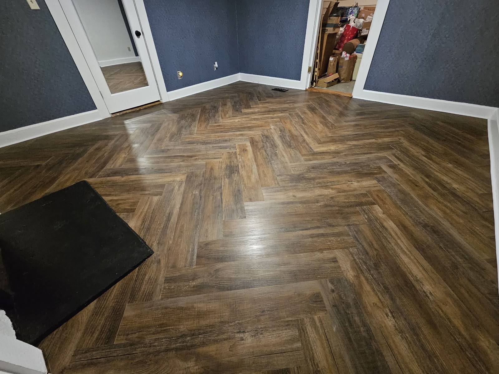 Completed dark walnut herringbone LVP floor